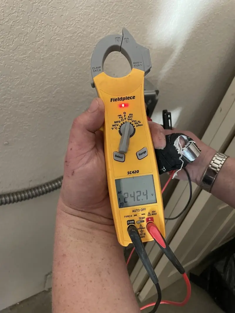 Voltage testing with clamp meter during Outlet Installation in Ogden